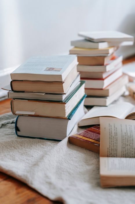 Stack of contradictory health literature and conflicting advice
